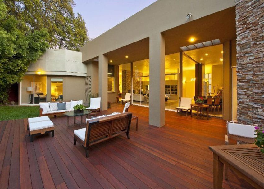 wood deck at modern home with cushioned wood furniture.jpg